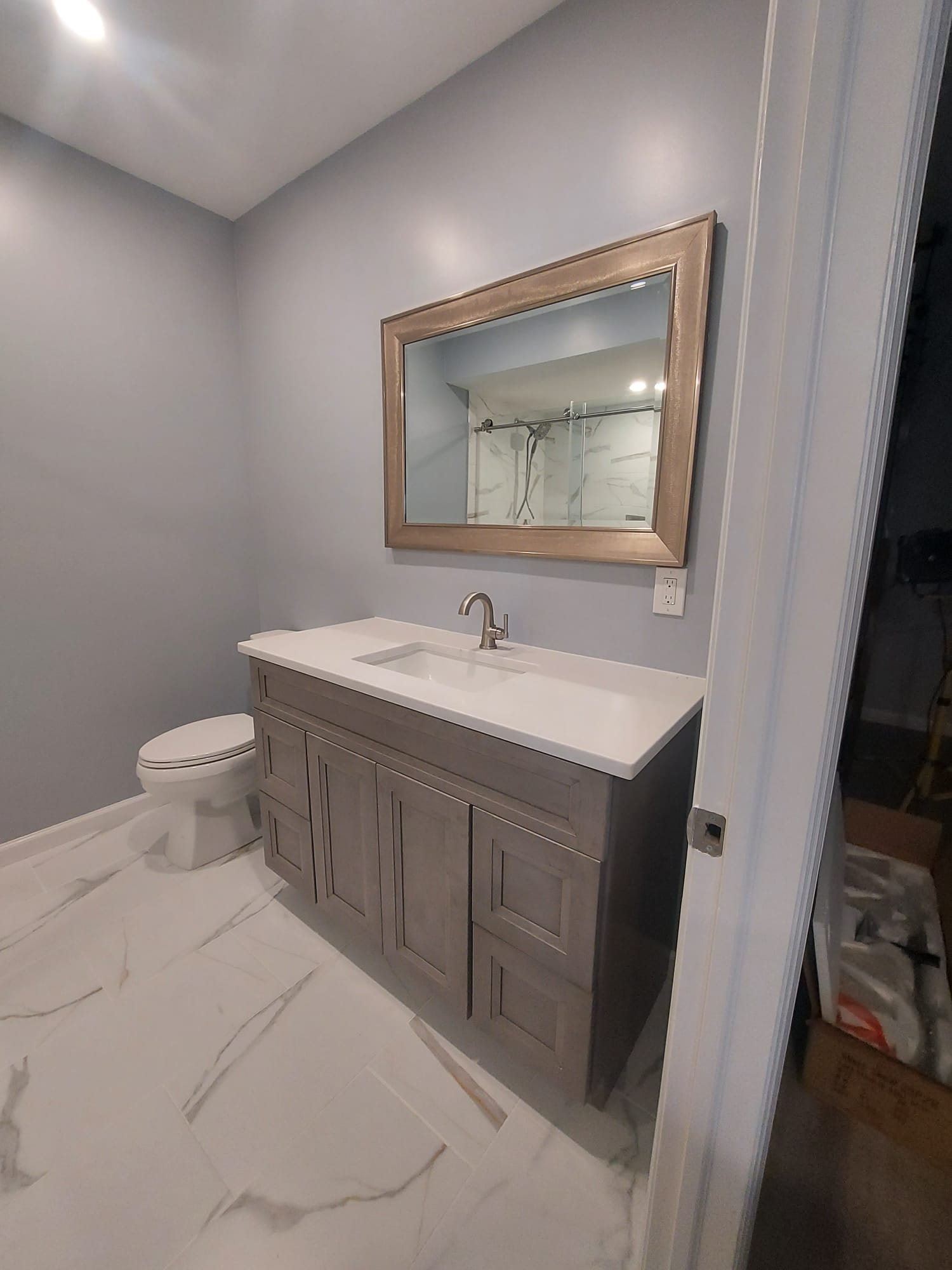 Bathroom Vanity and Tile Finish project by Binders Painting and Contracting